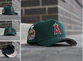 NEW ERA 9FORTY A-FRAME MLB ANAHEIM ANGELS 35TH ANNIVERSARY DARK GREEN / PINK UV SNAPBACK CAP